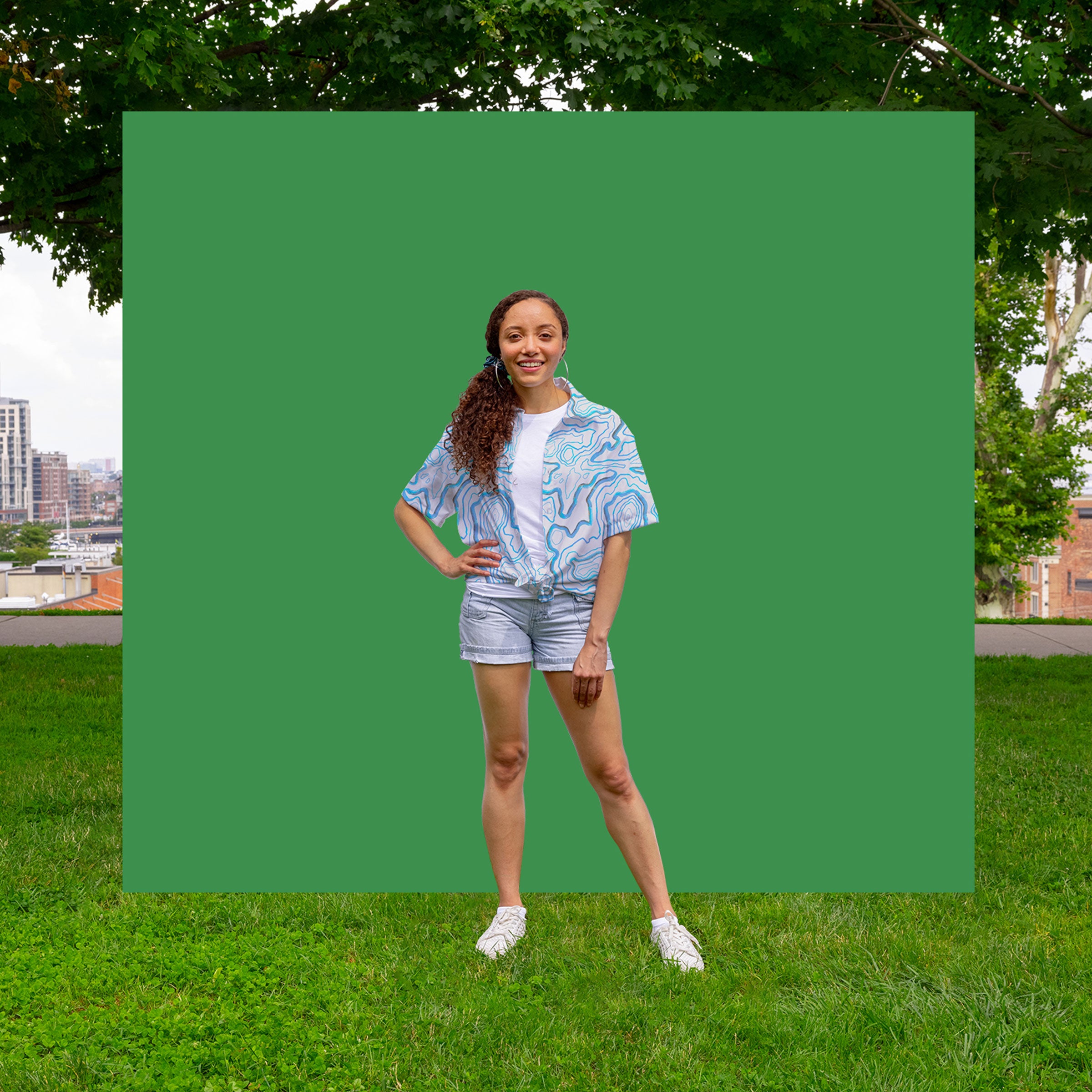niantic supply peaks and valeys button down on green background with model folded