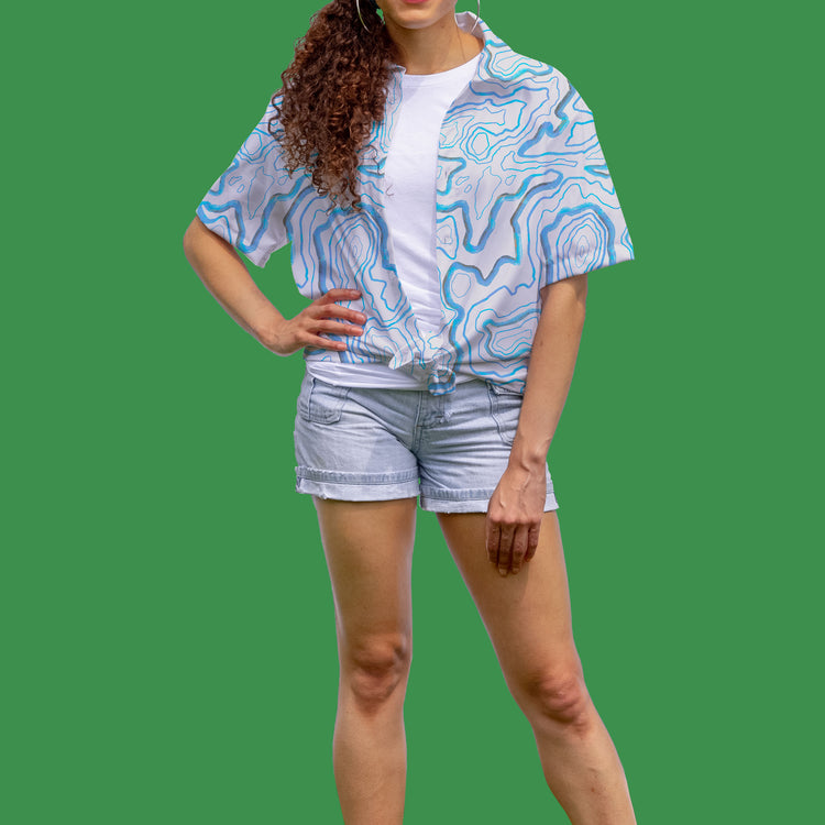 niantic supply peaks and valeys button down on green background with model folded zoomed in