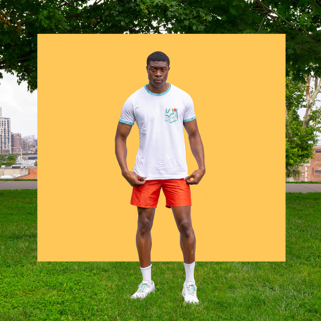 niantic supply ringer tee peaks and valleys on male model with yellow background