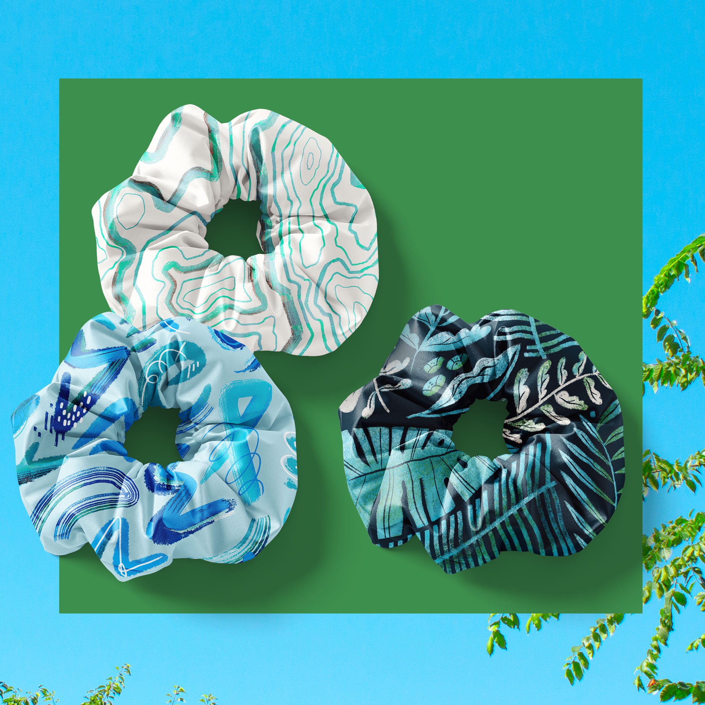 niantic supply scrunchies with three designs on a green background