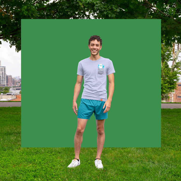 niantic having fun yeti pocket tee gray on model in front of green background